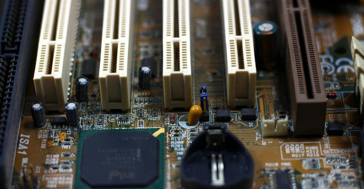 Detailed close-up of computer motherboard showing components like RAM slots and capacitors