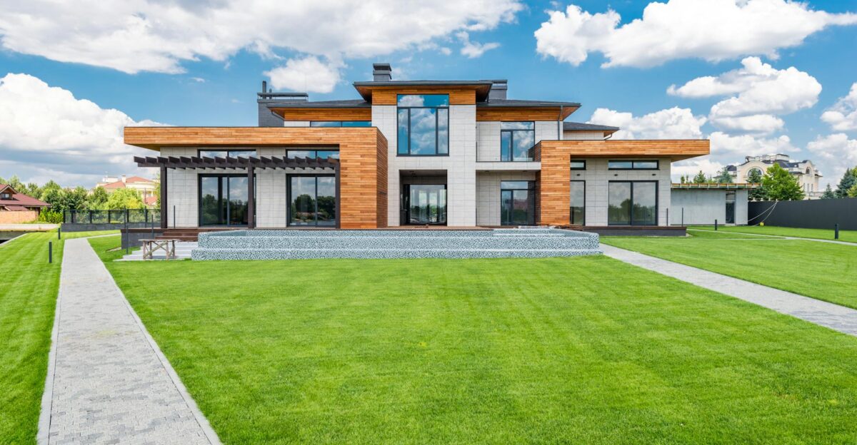 Stunning modern house exterior showcasing spacious lawn and contemporary architecture
