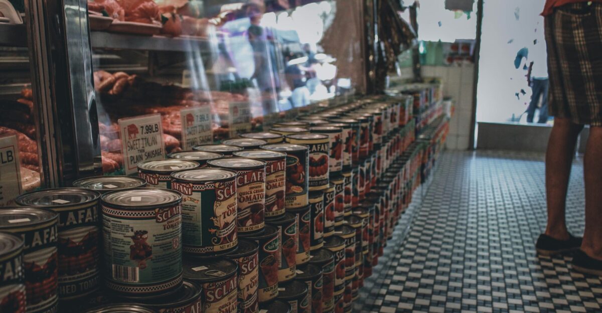 brown and white labeled cans on display counter