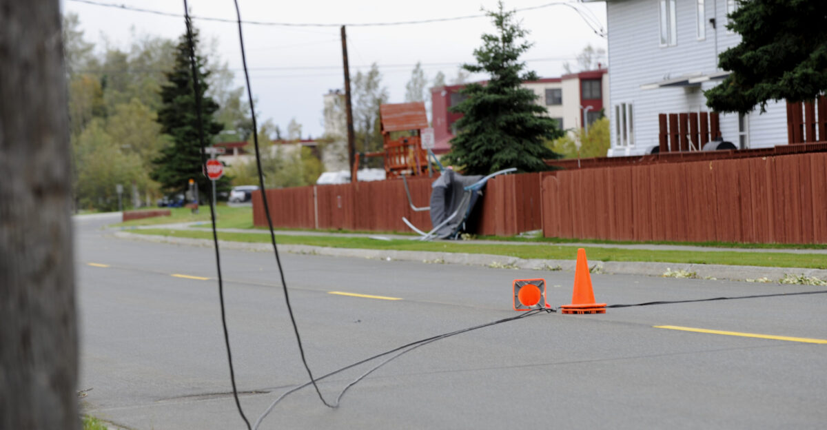 Two orange cones mark a downed power line after an arctic storm caused widespread damage as well as power and water outages on Joint Base Elmendorf-Richardson Alaska Sept 4 and 5 The storm which blew up from the Bering Sea brought wind gusts up to 100 mph according to the National Weather Service U S Air Force photo Tech Sgt Brian Ferguson