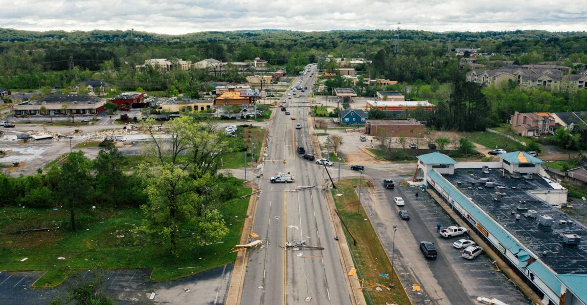 Aerial view of a damaged urban street with minimal traffic highlighting storm aftermath in Chattanooga TN
