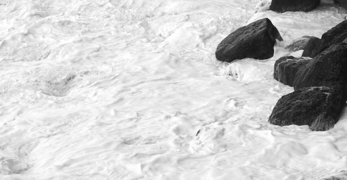 grayscale photo of water waves