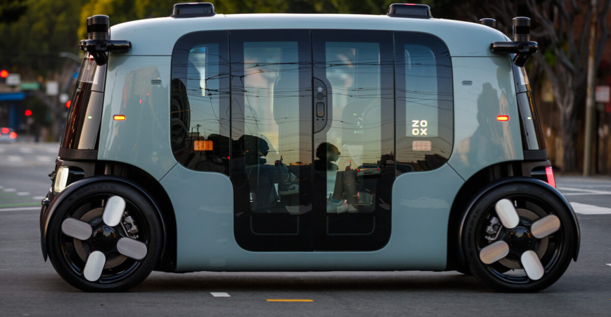 An occupied Zoox Robotaxi crosses Potrero St in San Francisco