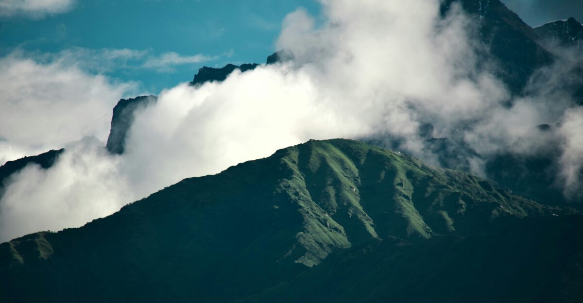 Mountains peek through clouds
